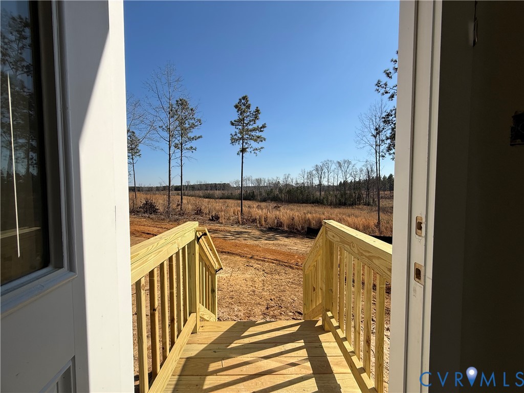 4632 Country Club Road La Crosse, VA 23950 - Photo 21 of 21 a view of a balcony with couches and wooden floor