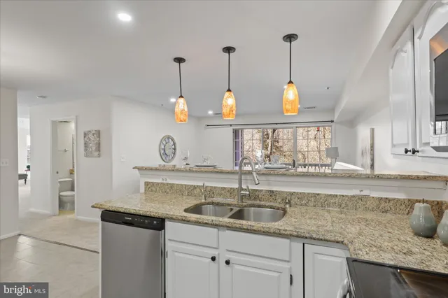 a kitchen with a sink and a window