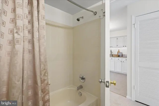 a bathroom with a bathtub and shower