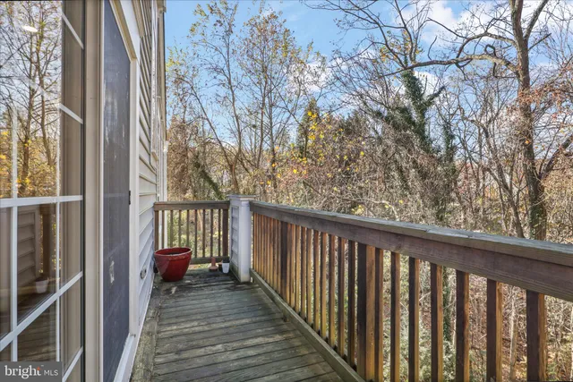 a view of a balcony with wooden floor
