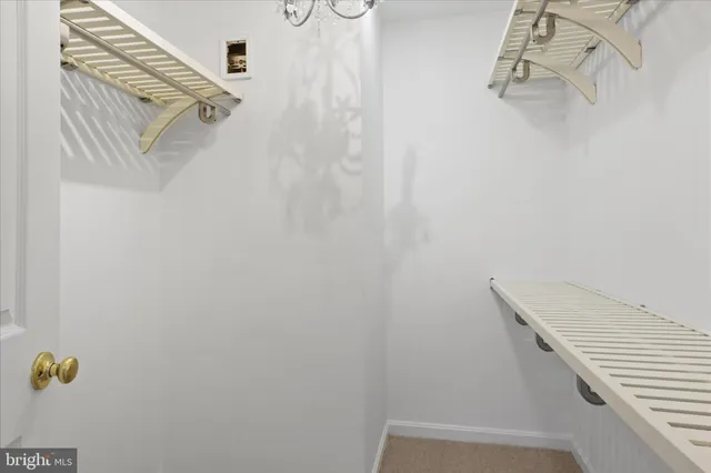 a view of staircase with white walls