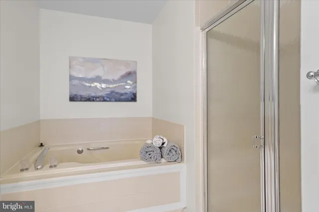 a bathroom with a tub and sink
