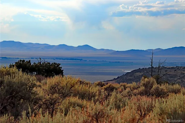 a view of a lake with mountains in the background