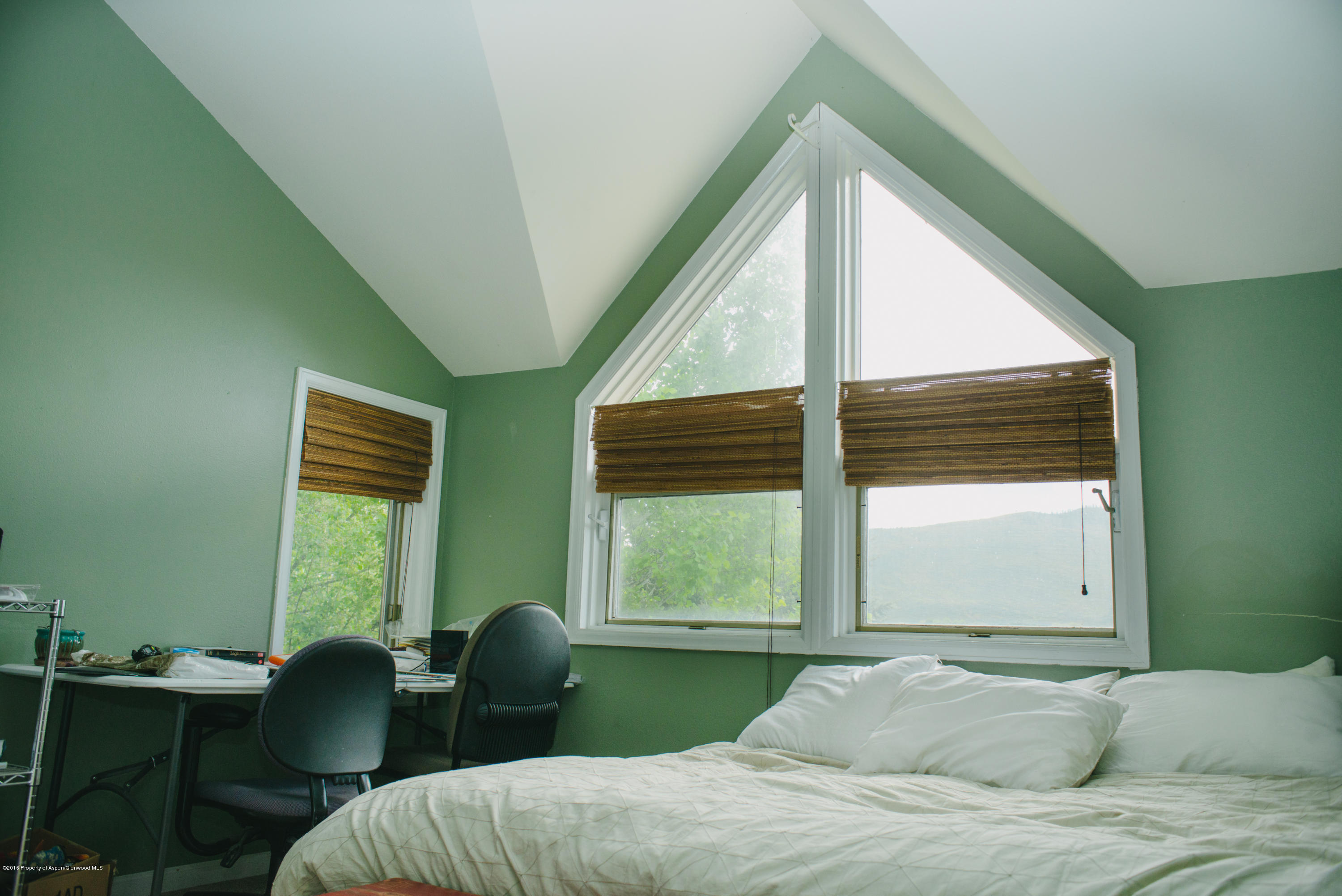 95 Silverado Drive Basalt, CO 81621 - Photo 11 of 18 a bedroom with a bed and windows