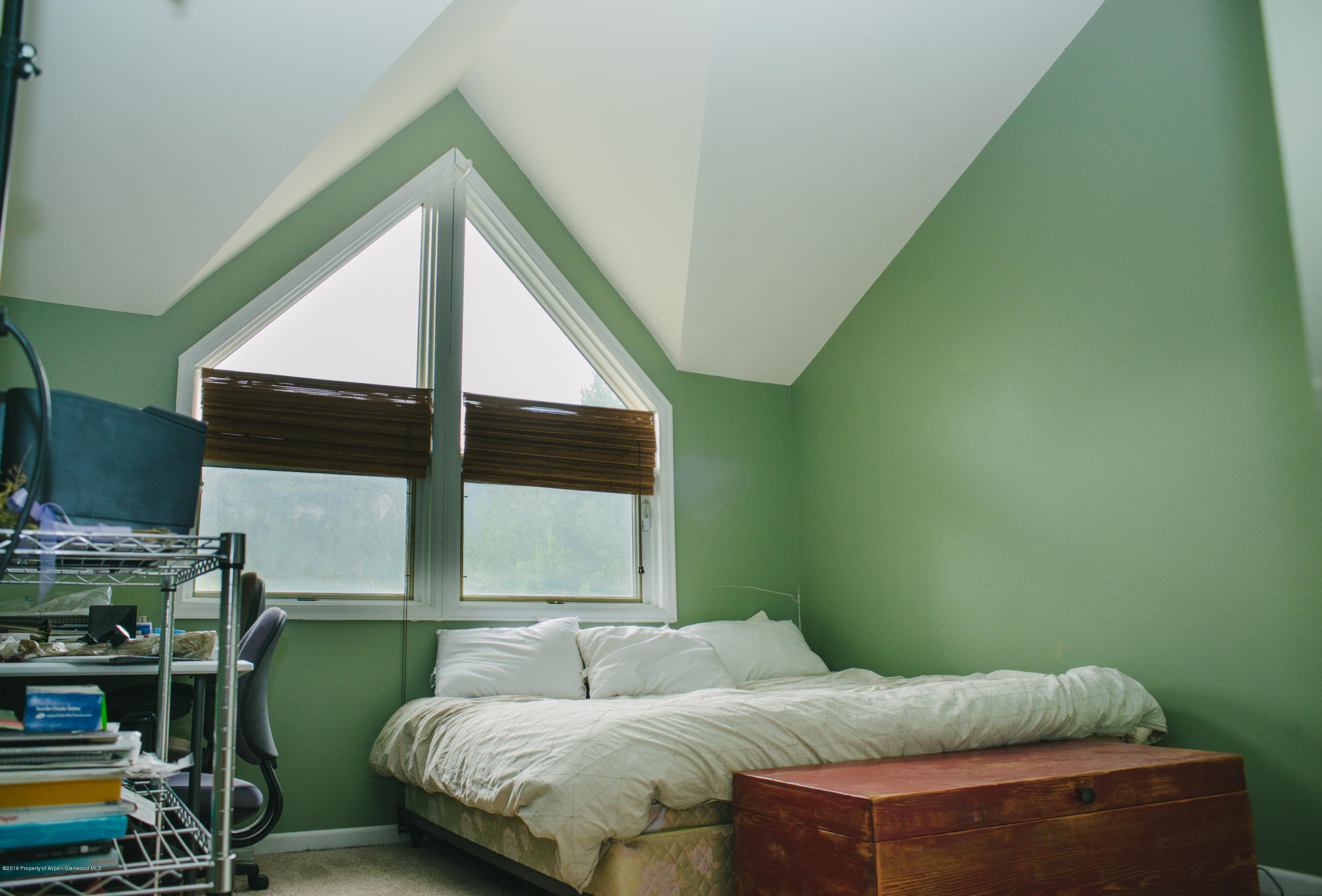 95 Silverado Drive Basalt, CO 81621 - Photo 12 of 18 a bedroom with a bed and a window