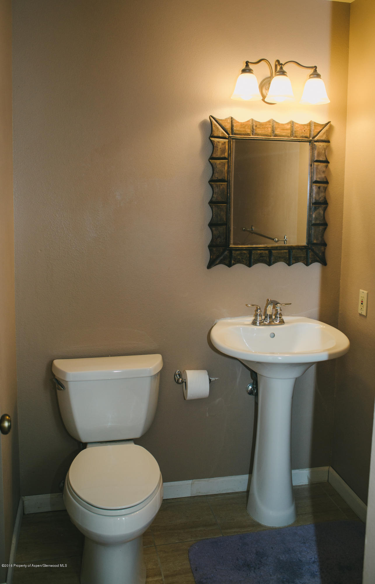 95 Silverado Drive Basalt, CO 81621 - Photo 14 of 18 a bathroom with a toilet sink and mirror