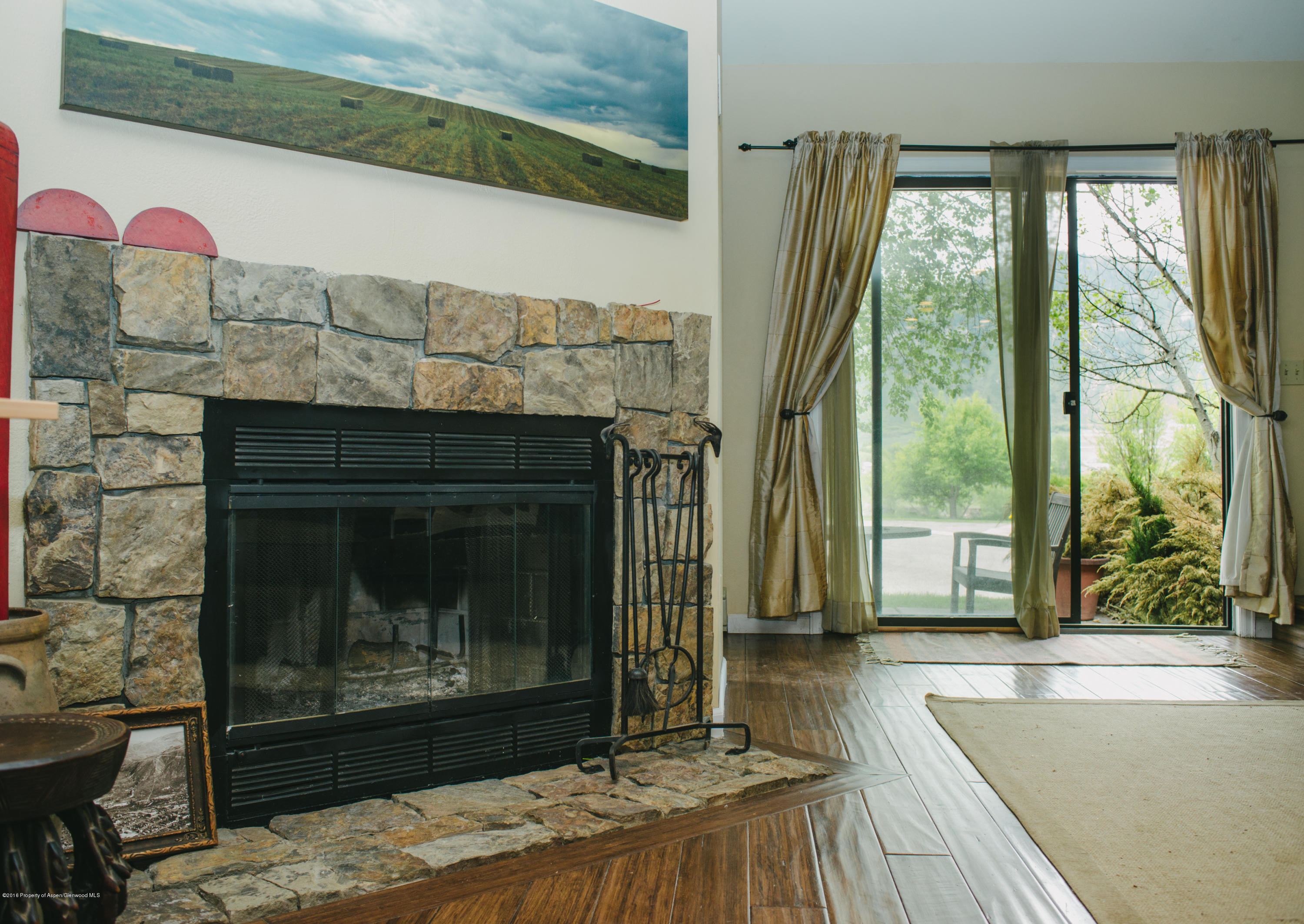 95 Silverado Drive Basalt, CO 81621 - Photo 18 of 18 a room with fireplace and a wooden floor