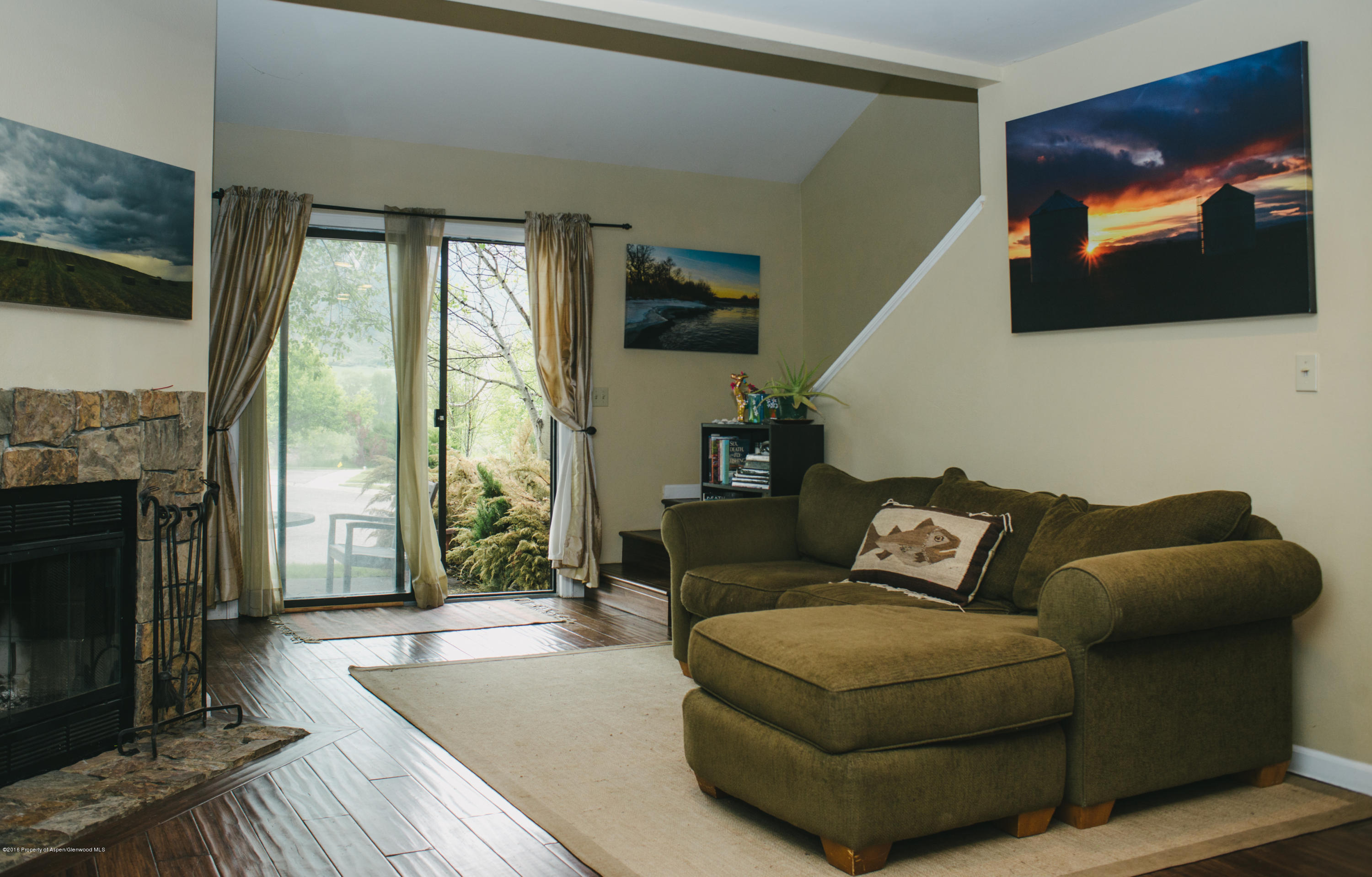 95 Silverado Drive Basalt, CO 81621 - Photo 3 of 18 a living room with furniture a flat screen tv and a fireplace