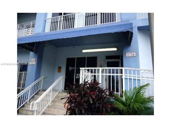 2734 Bird Avenue, Unit 205 Miami, FL 33133 - Photo 16 of 20 a view of front door and deck of the house