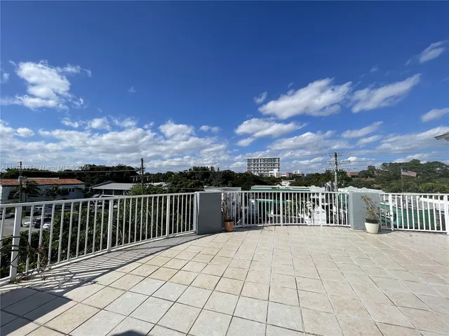 a view of balcony with furniture