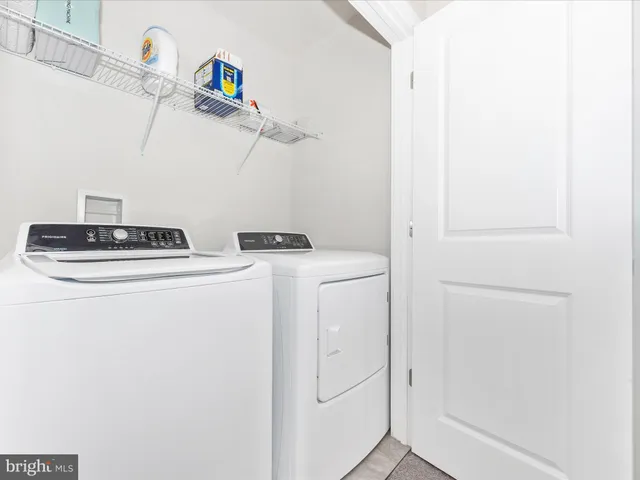 a living room with a couch and a window
