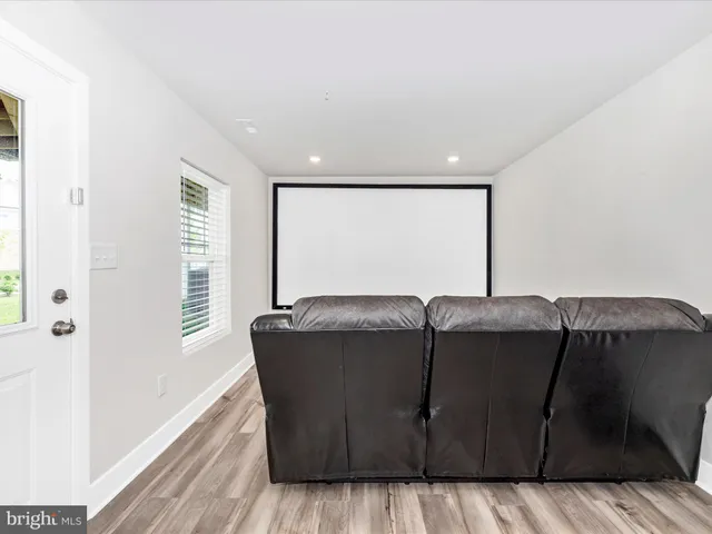 a living room with a couch and a rug