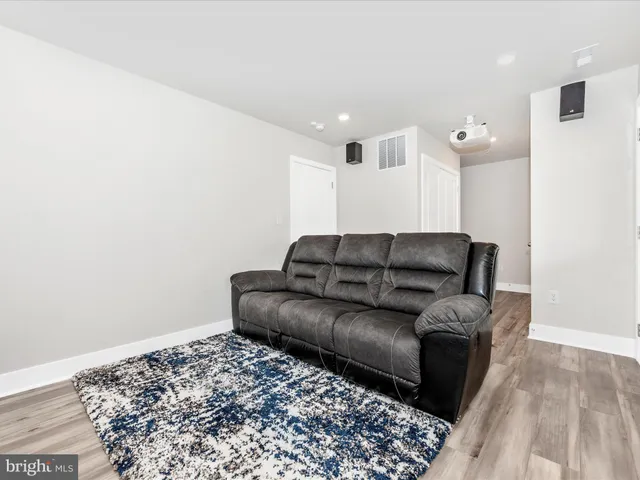 a living room with a couch and a window