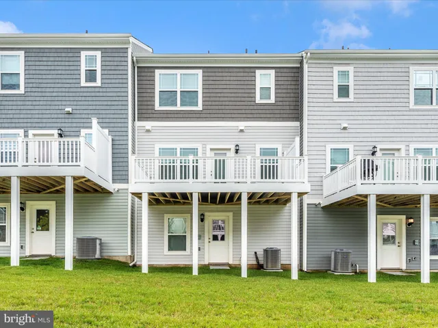 a large building with a yard in front of it