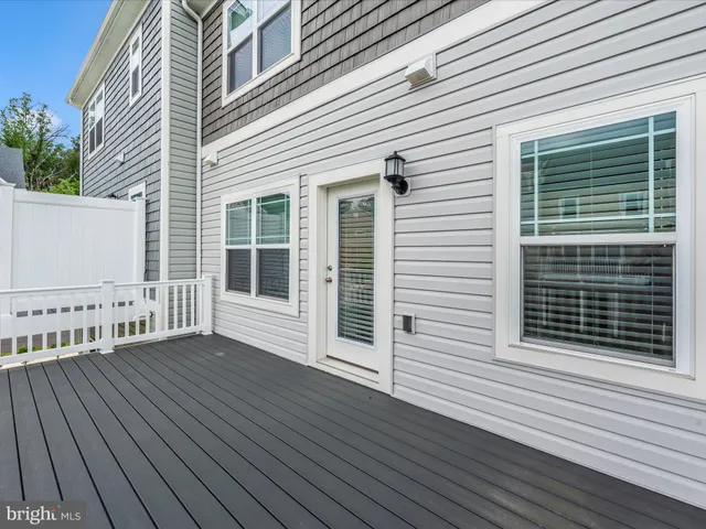 a view of a backyard with plants and patio