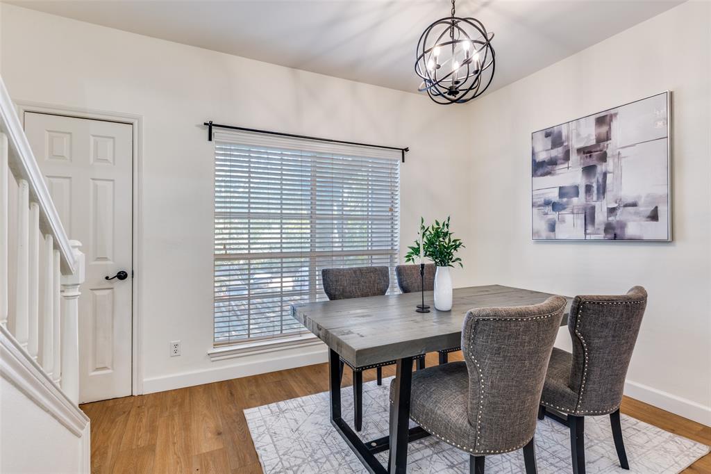 8555 Fair Oaks Crossing, Unit 702 Dallas, TX 75243 - Photo 11 of 26 a view of a dining room with furniture window and wooden floor