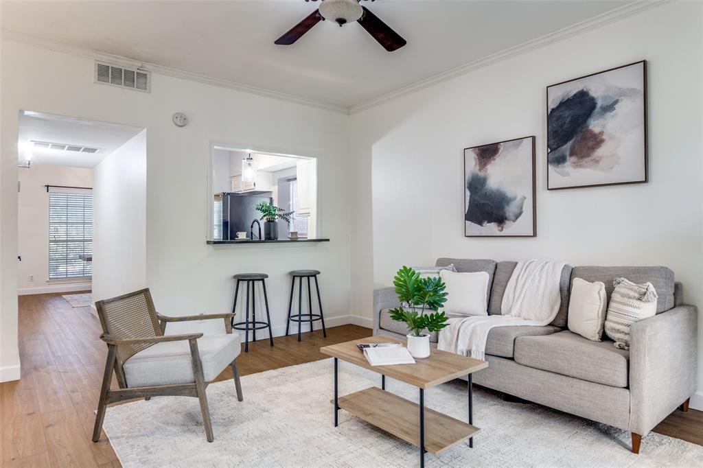 8555 Fair Oaks Crossing, Unit 702 Dallas, TX 75243 - Photo 14 of 26 a living room with furniture and a potted plant