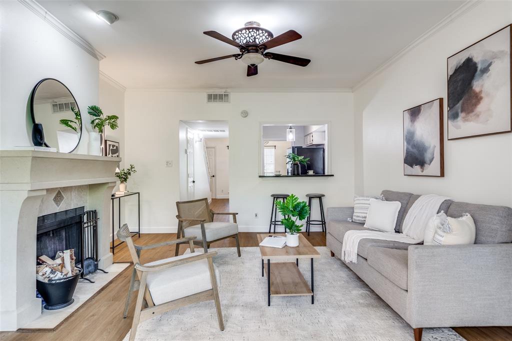 8555 Fair Oaks Crossing, Unit 702 Dallas, TX 75243 - Photo 15 of 26 a living room with furniture and a fireplace
