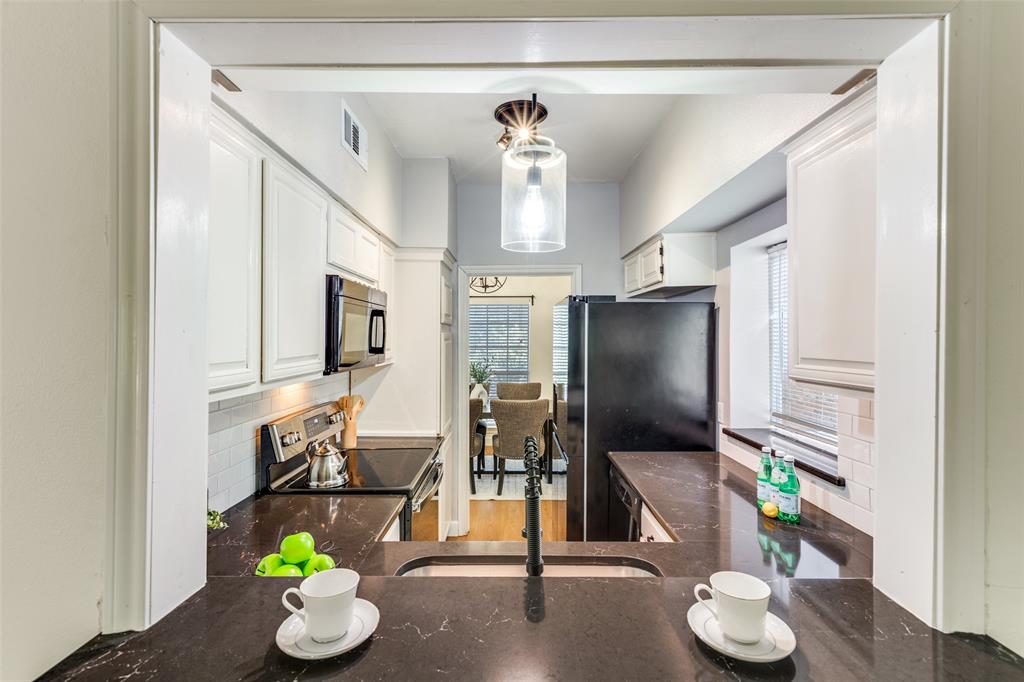8555 Fair Oaks Crossing, Unit 702 Dallas, TX 75243 - Photo 2 of 26 a living room with furniture and a flat screen tv