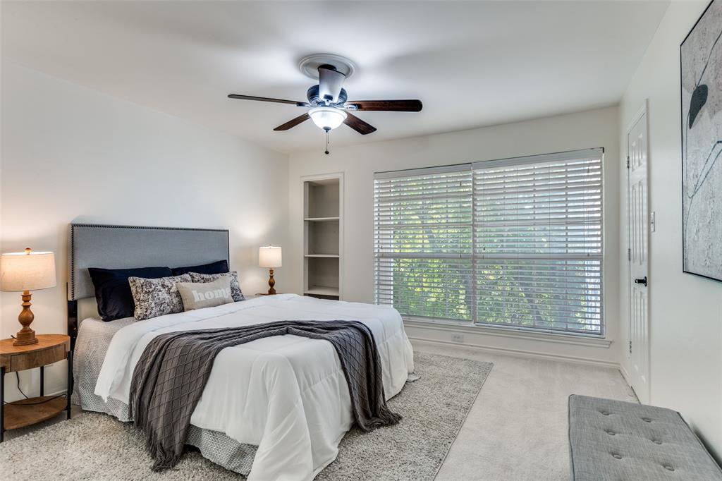 8555 Fair Oaks Crossing, Unit 702 Dallas, TX 75243 - Photo 3 of 26 a bedroom with a large bed and a window