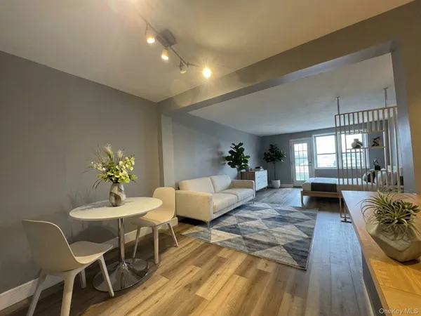 a kitchen with stainless steel appliances kitchen island granite countertop a refrigerator and a sink