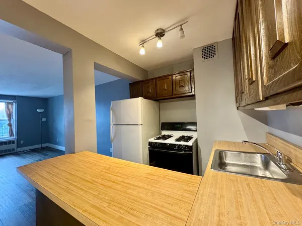 a bathroom with a sink mirror vanity and bathtub