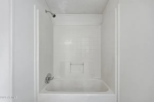 a white bath tub sitting in a bathroom