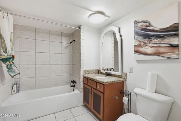 a bathroom with a sink a toilet and bathtub
