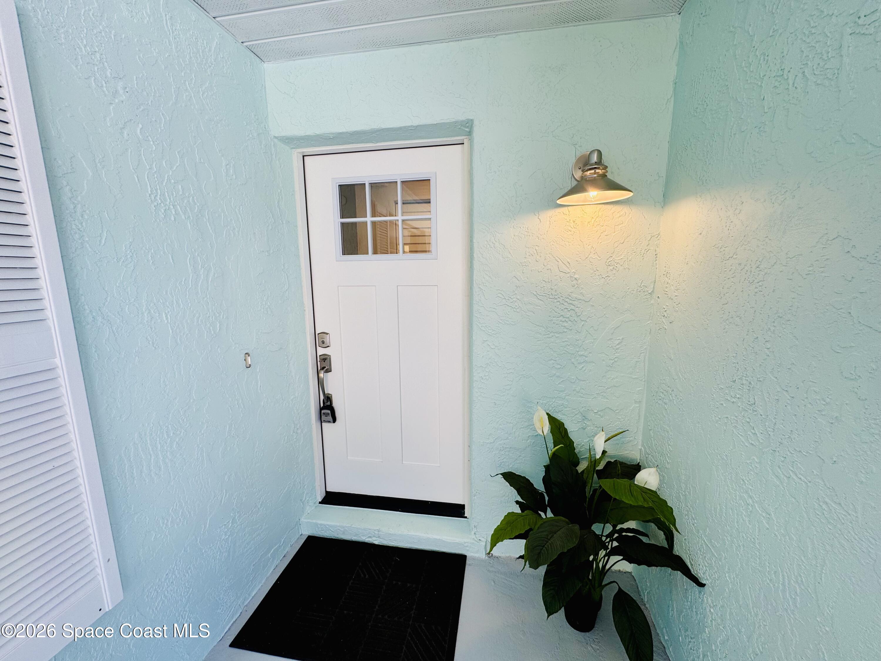 1910 Tallridge Road Melbourne, FL 32935 - Photo 4 of 34 front door