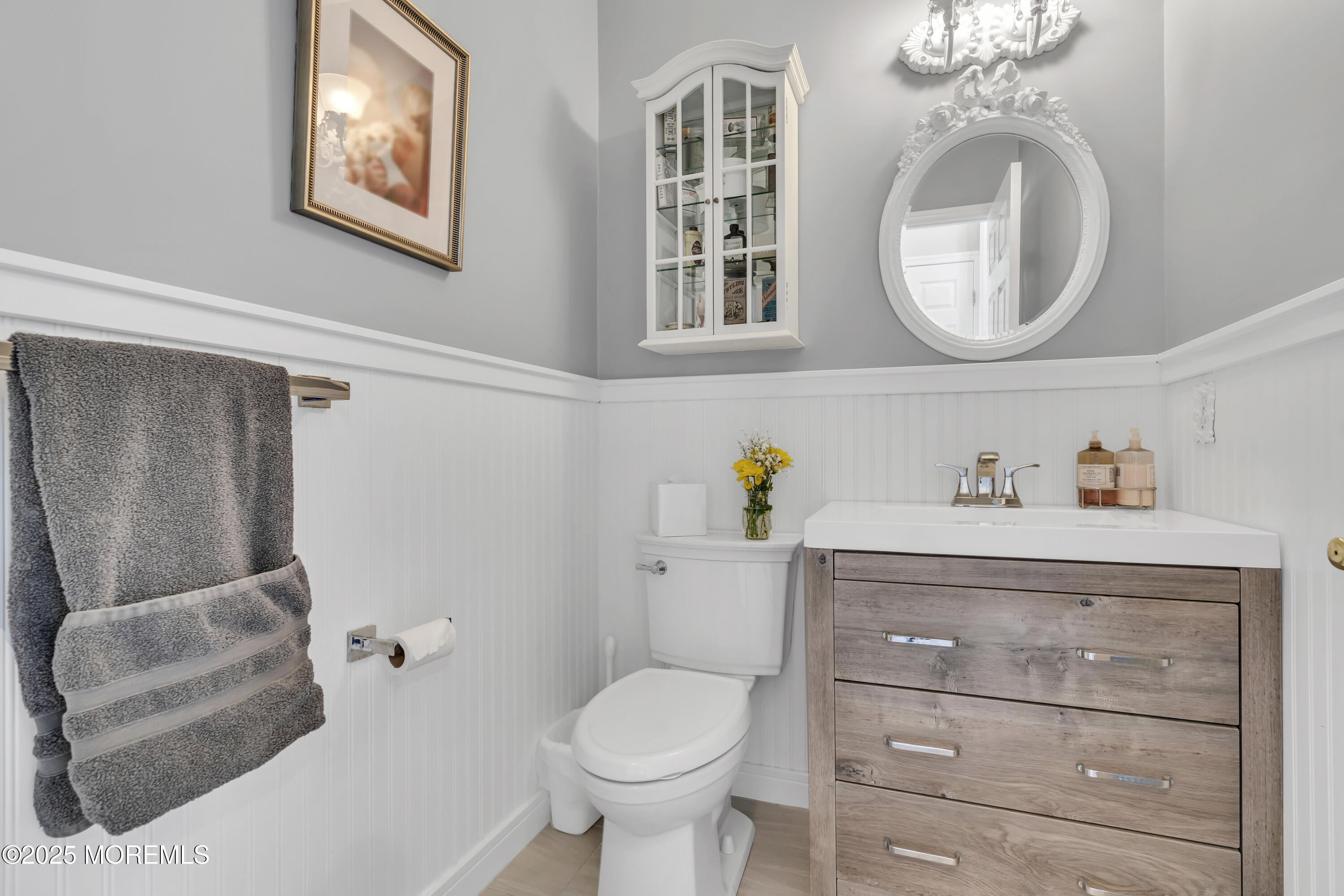 43 Periwinkle Circle Tinton Falls, NJ 07712 - Photo 12 of 60 a bathroom with a toilet sink and mirror