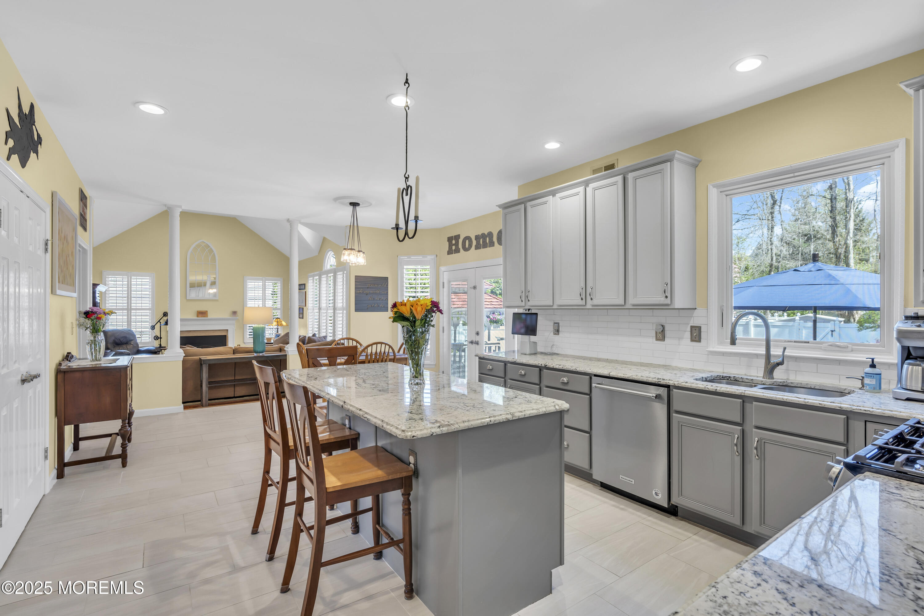 43 Periwinkle Circle Tinton Falls, NJ 07712 - Photo 18 of 60 a kitchen with a table chairs sink and cabinets