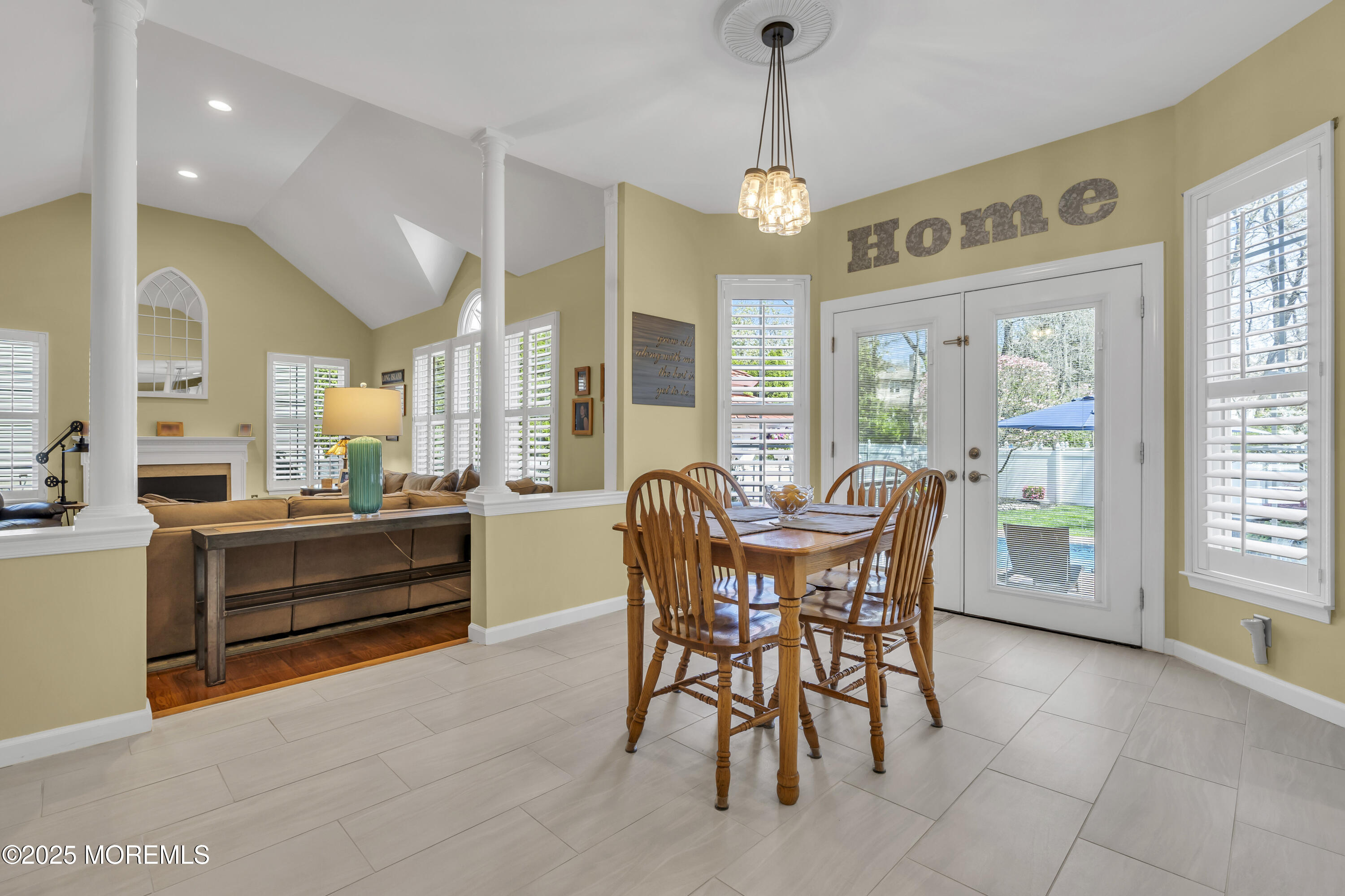 43 Periwinkle Circle Tinton Falls, NJ 07712 - Photo 23 of 60 a dining room with furniture a chandelier and fireplace