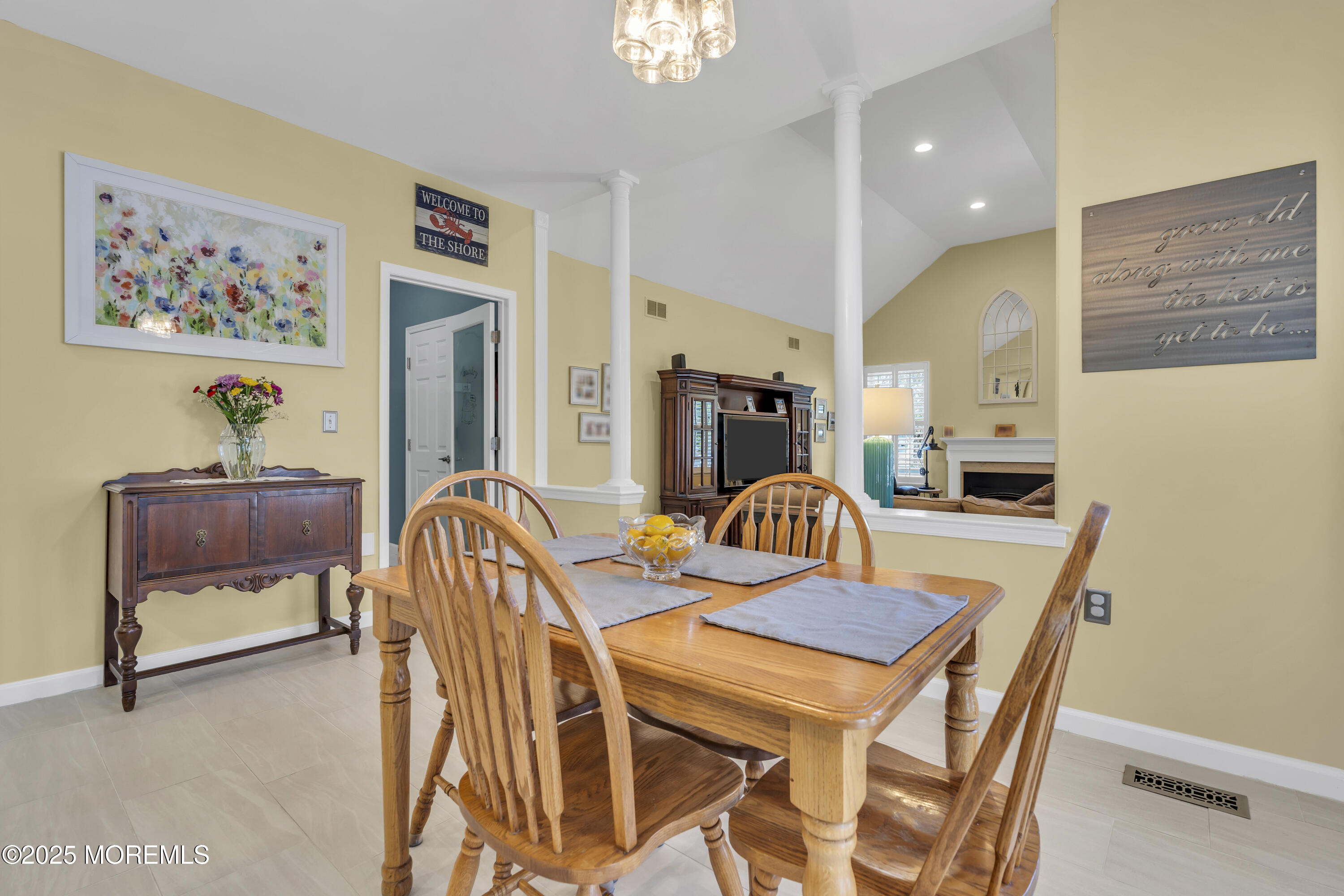 43 Periwinkle Circle Tinton Falls, NJ 07712 - Photo 24 of 60 a view of a dining room with furniture and a chandelier