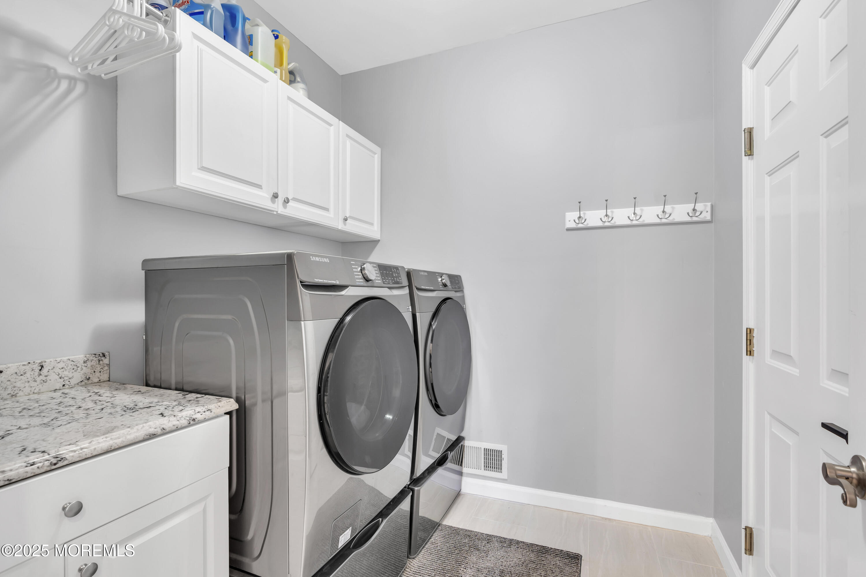 43 Periwinkle Circle Tinton Falls, NJ 07712 - Photo 26 of 60 a utility room with dryer and washer