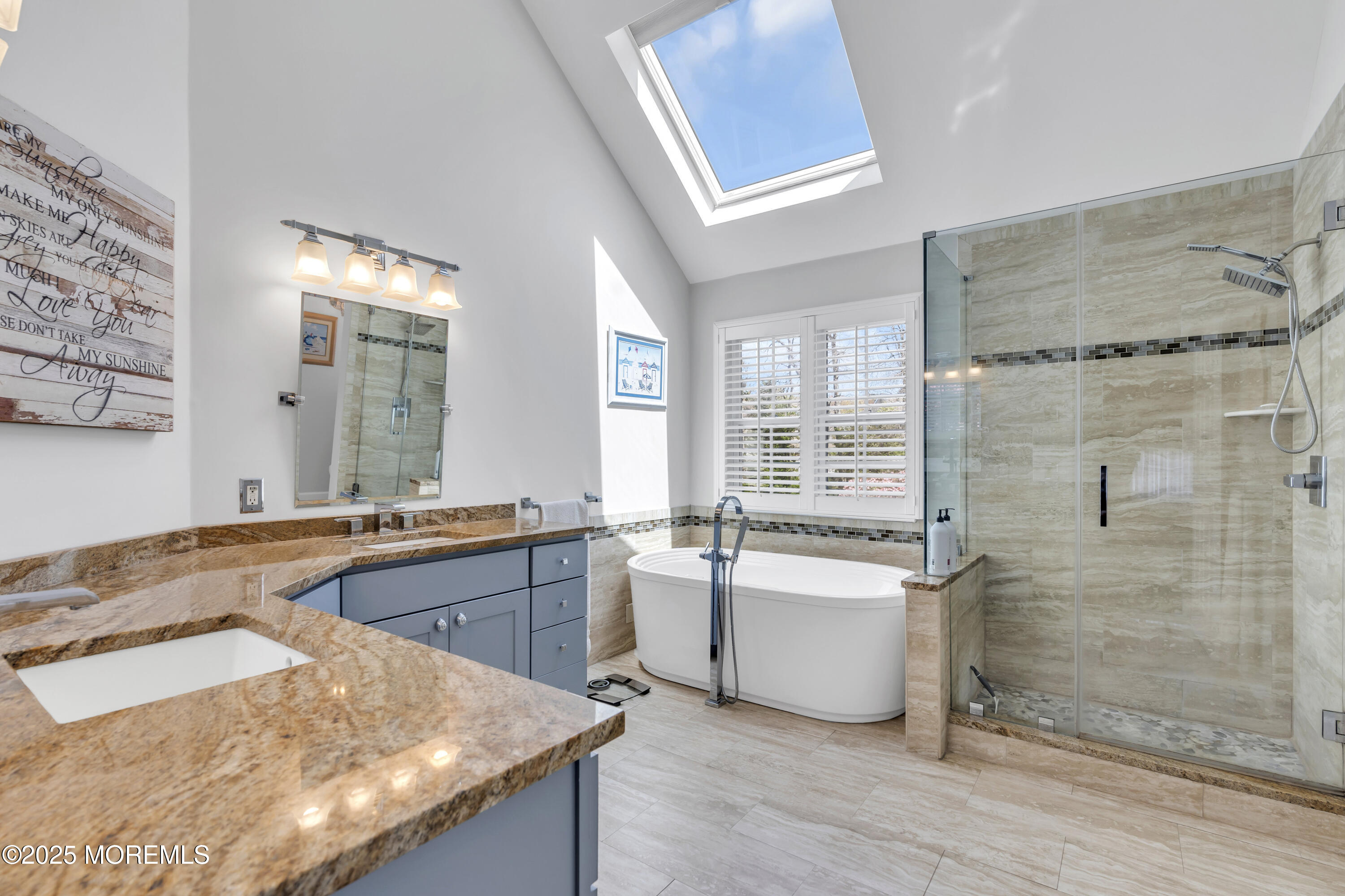 43 Periwinkle Circle Tinton Falls, NJ 07712 - Photo 33 of 60 a large bathroom with a granite countertop tub a sink and a mirror