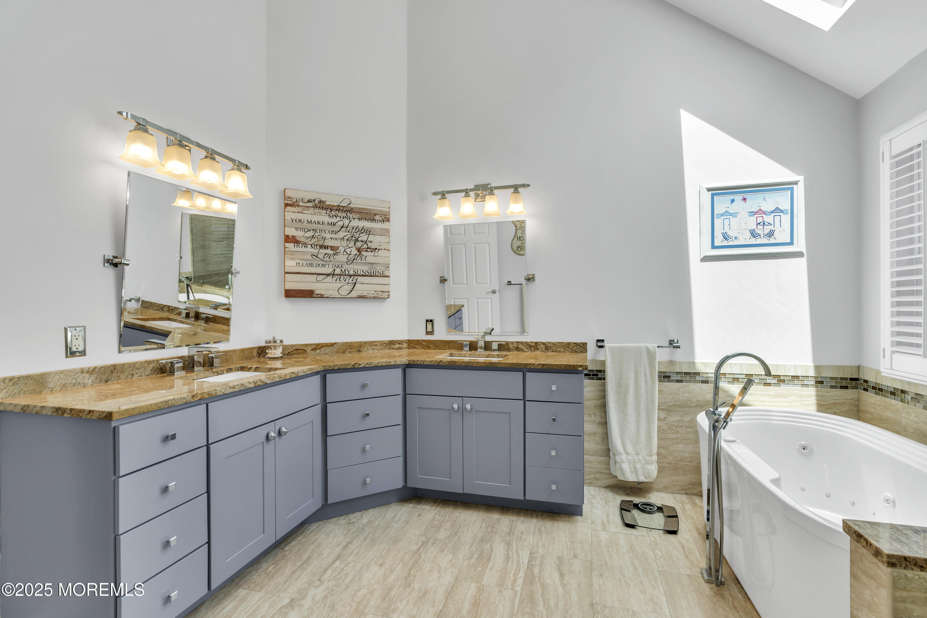 43 Periwinkle Circle Tinton Falls, NJ 07712 - Photo 34 of 60 a spacious bathroom with a granite countertop sink mirror and bathtub