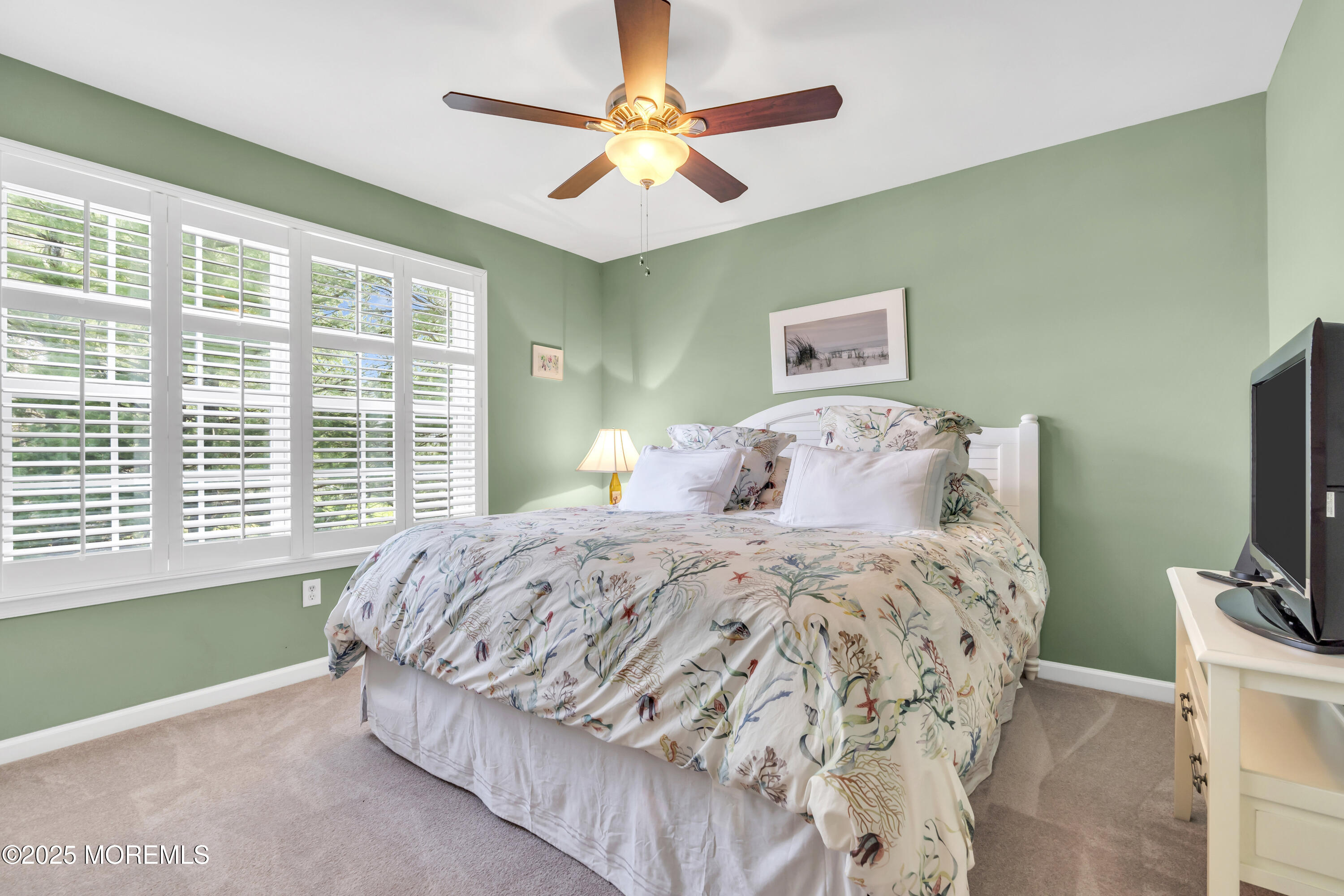 43 Periwinkle Circle Tinton Falls, NJ 07712 - Photo 37 of 60 a bedroom with a bed and a flat tv screen on dresser