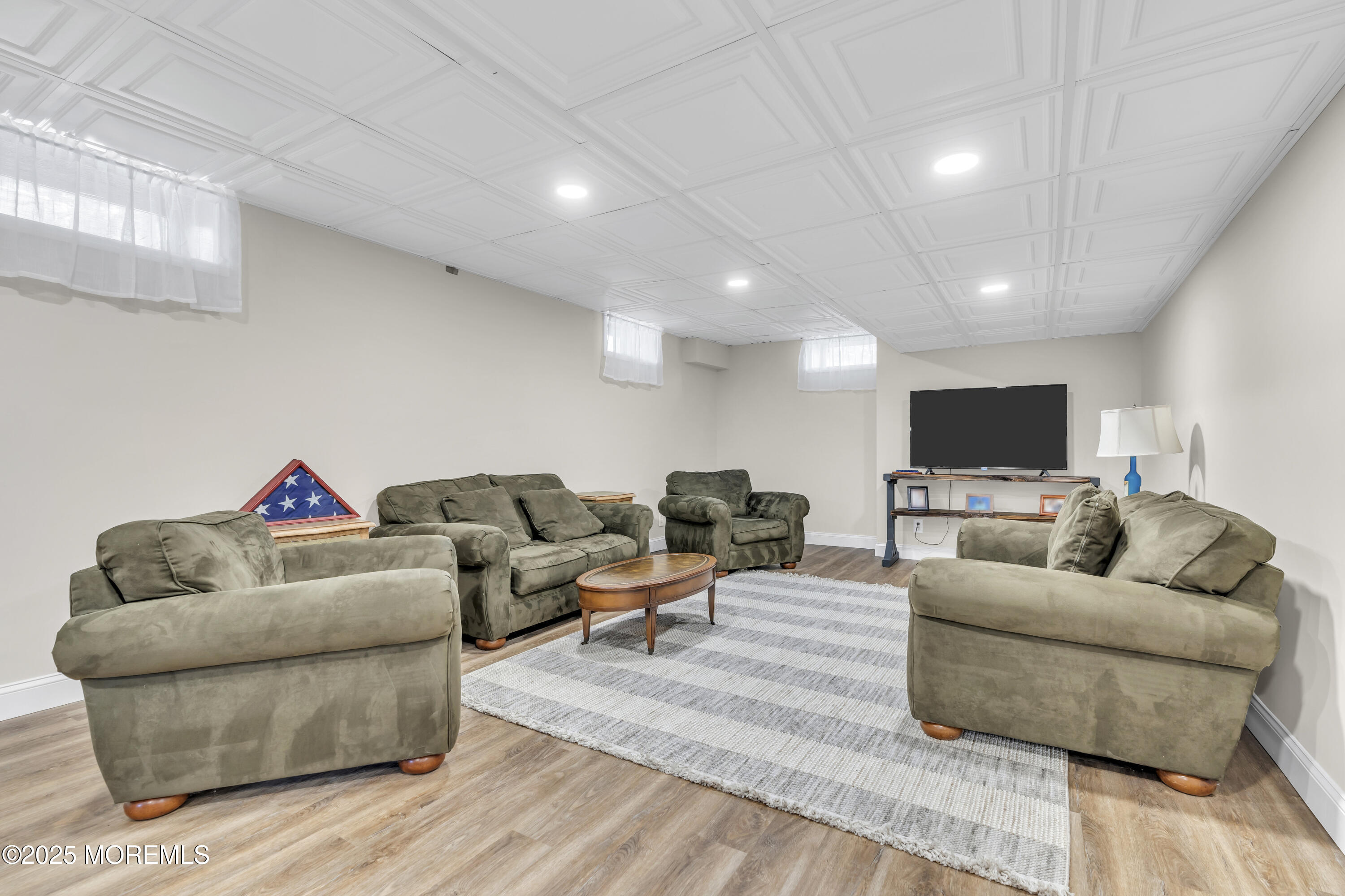 43 Periwinkle Circle Tinton Falls, NJ 07712 - Photo 42 of 60 a living room with furniture and a flat screen tv