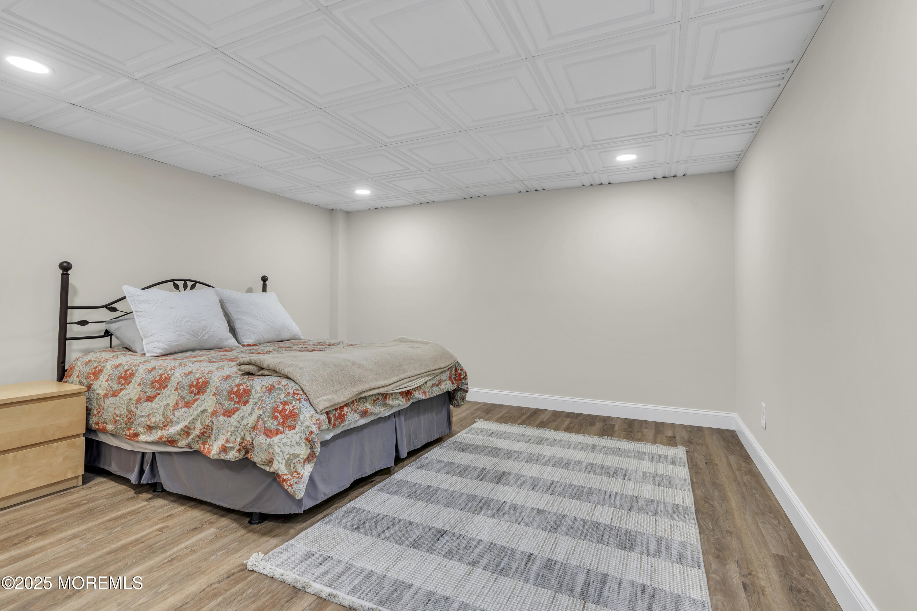 43 Periwinkle Circle Tinton Falls, NJ 07712 - Photo 46 of 60 a bedroom with a bed and a night stand