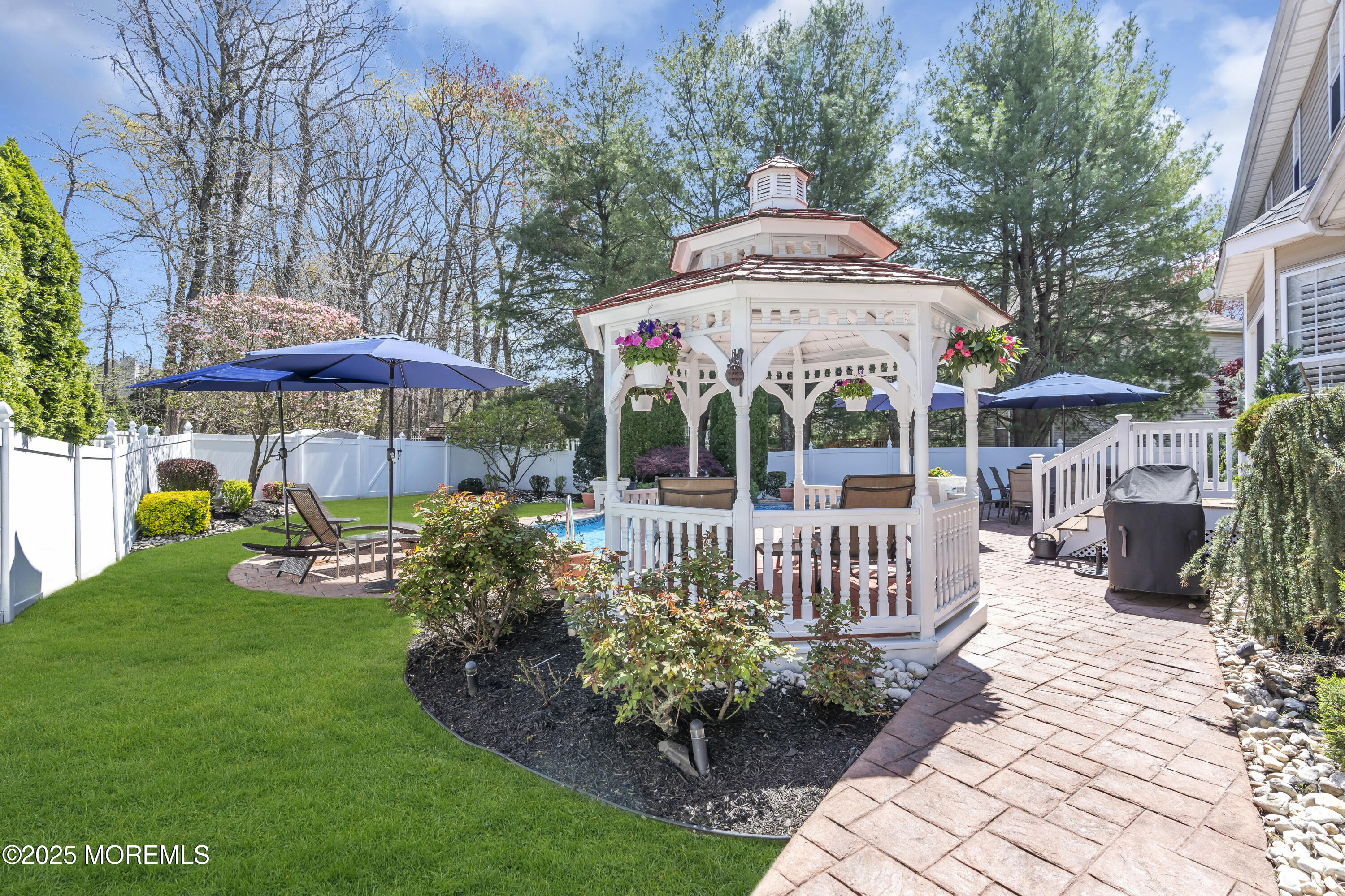 43 Periwinkle Circle Tinton Falls, NJ 07712 - Photo 50 of 60 a view of a patio with furniture and a garden