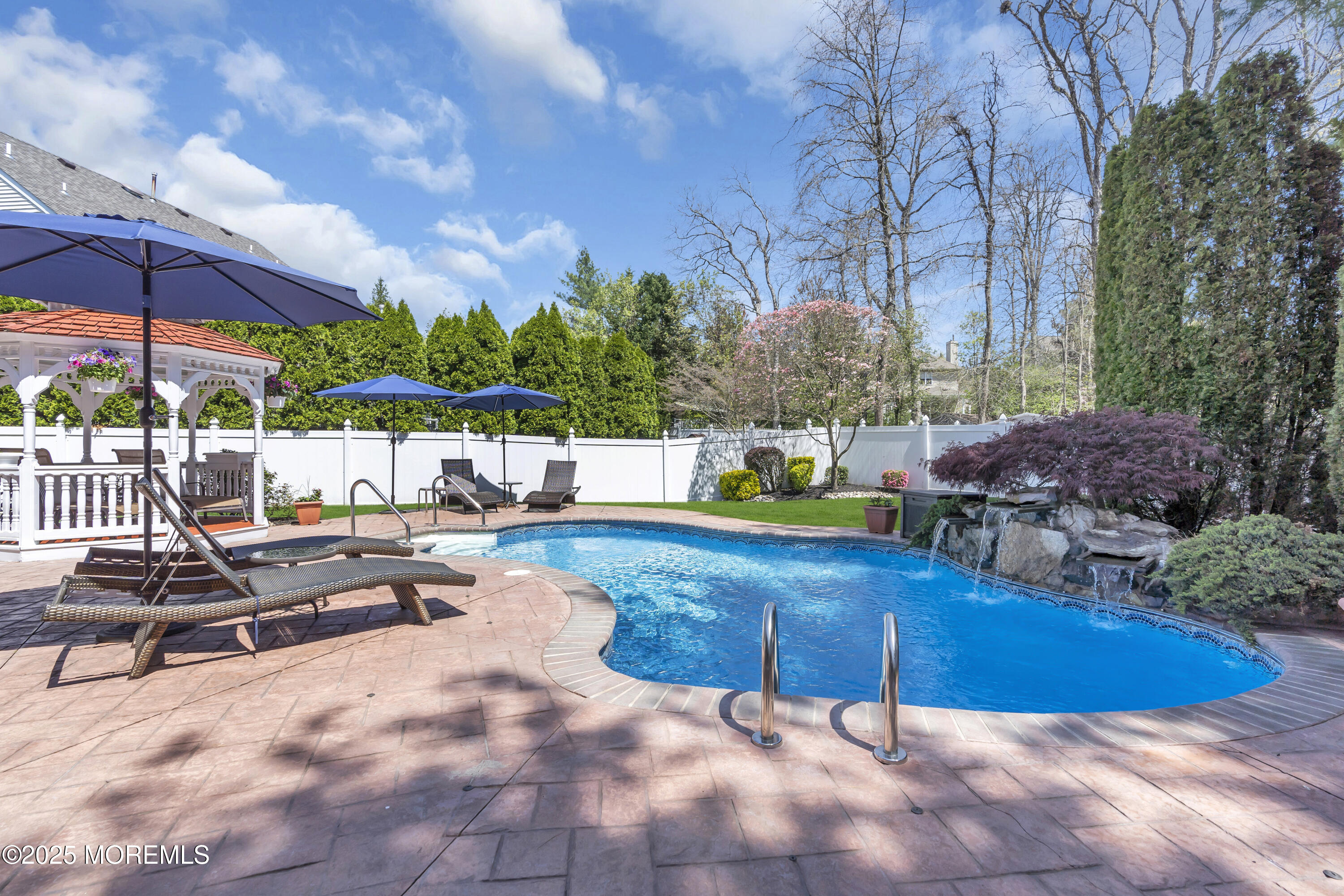 43 Periwinkle Circle Tinton Falls, NJ 07712 - Photo 55 of 60 a view of a swimming pool with a patio