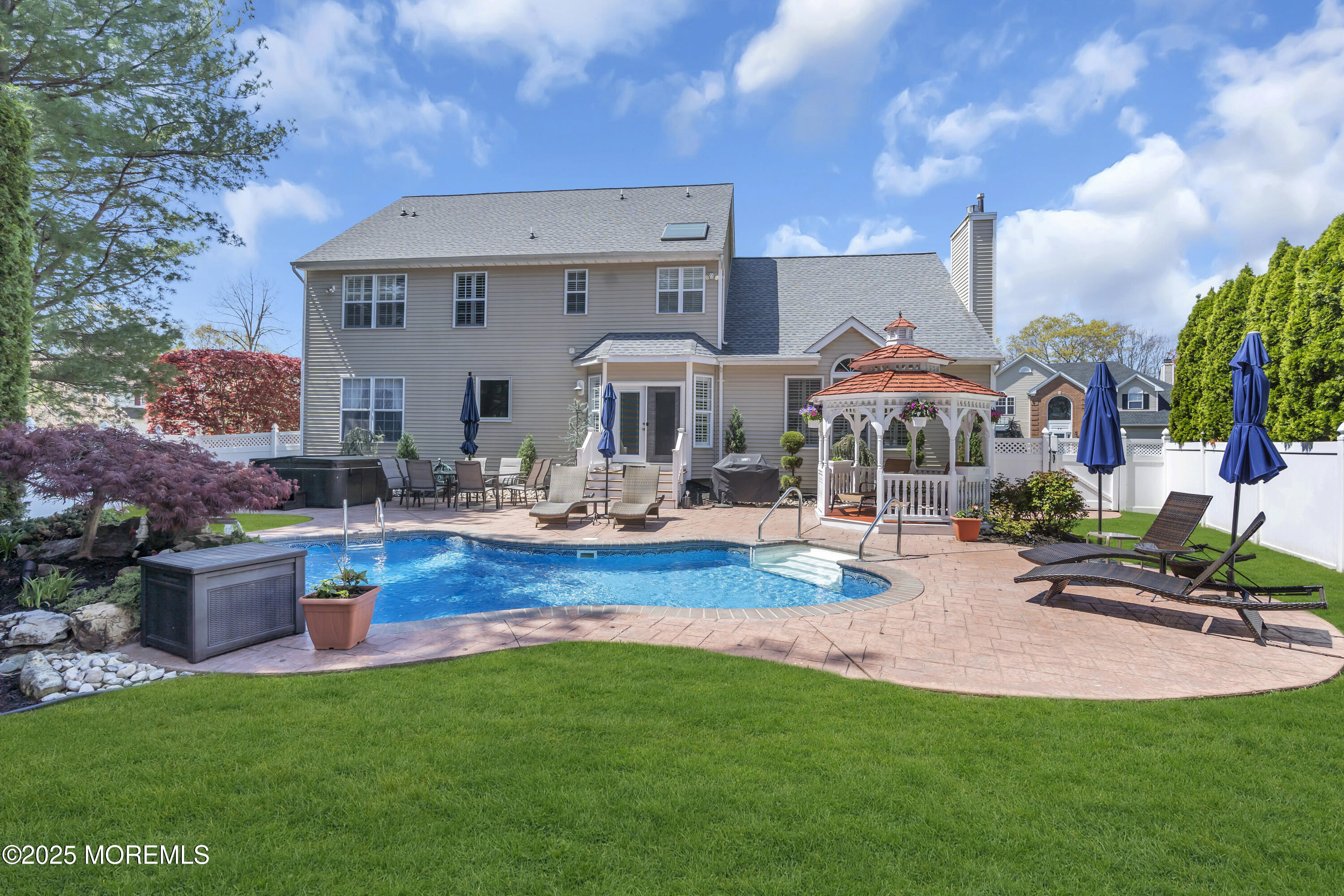43 Periwinkle Circle Tinton Falls, NJ 07712 - Photo 57 of 60 a view of a house with pool and chairs