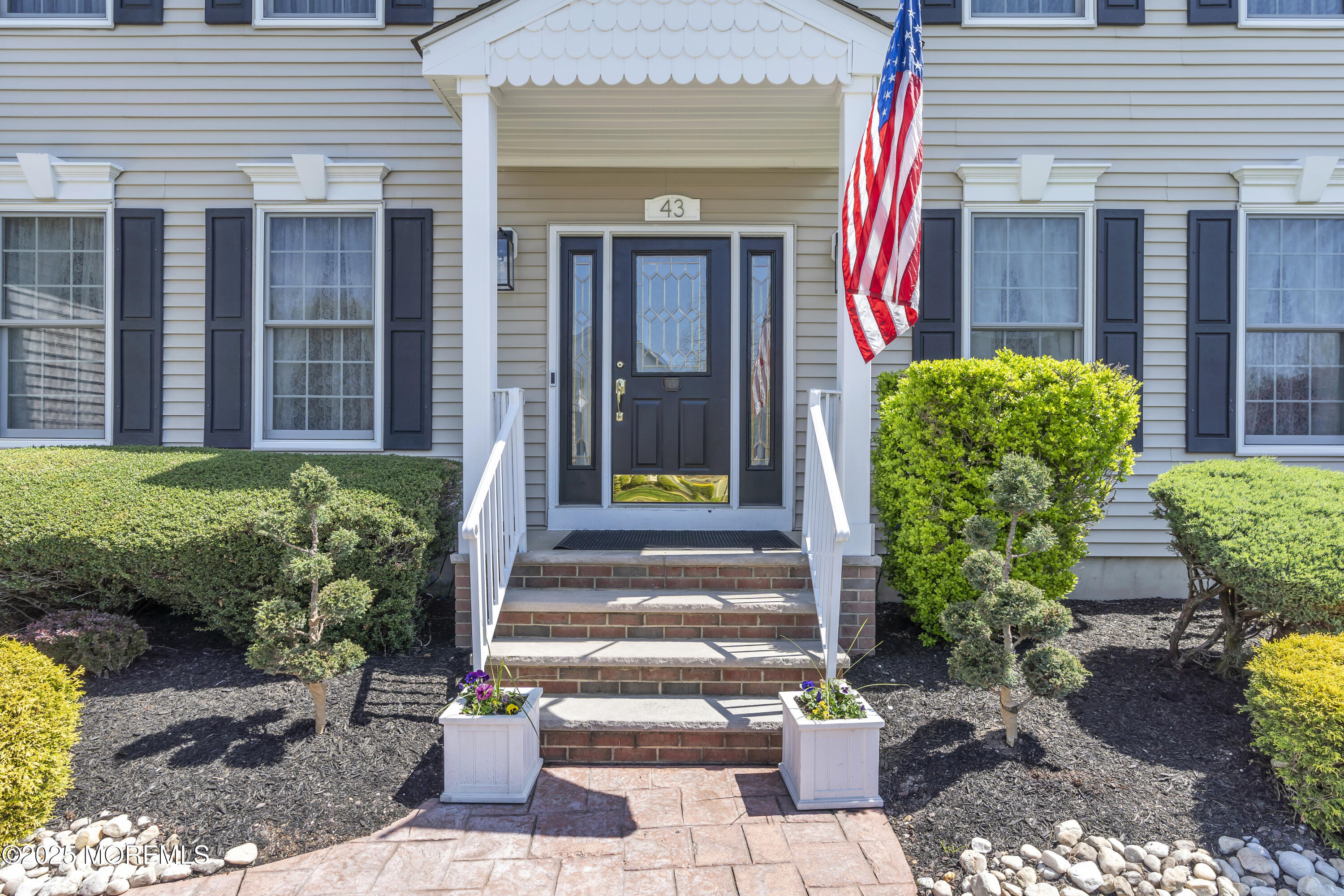 43 Periwinkle Circle Tinton Falls, NJ 07712 - Photo 6 of 60 a front view of a house with garden