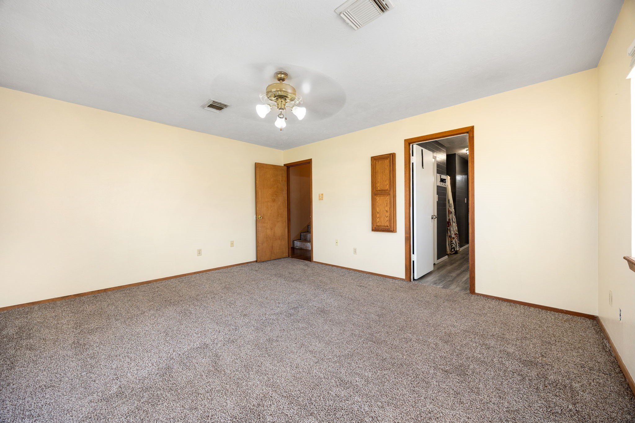 236 Pine Ridge Drive Cleveland, TX 77327 - Photo 13 of 30 an empty room with chandelier fan and closet area
