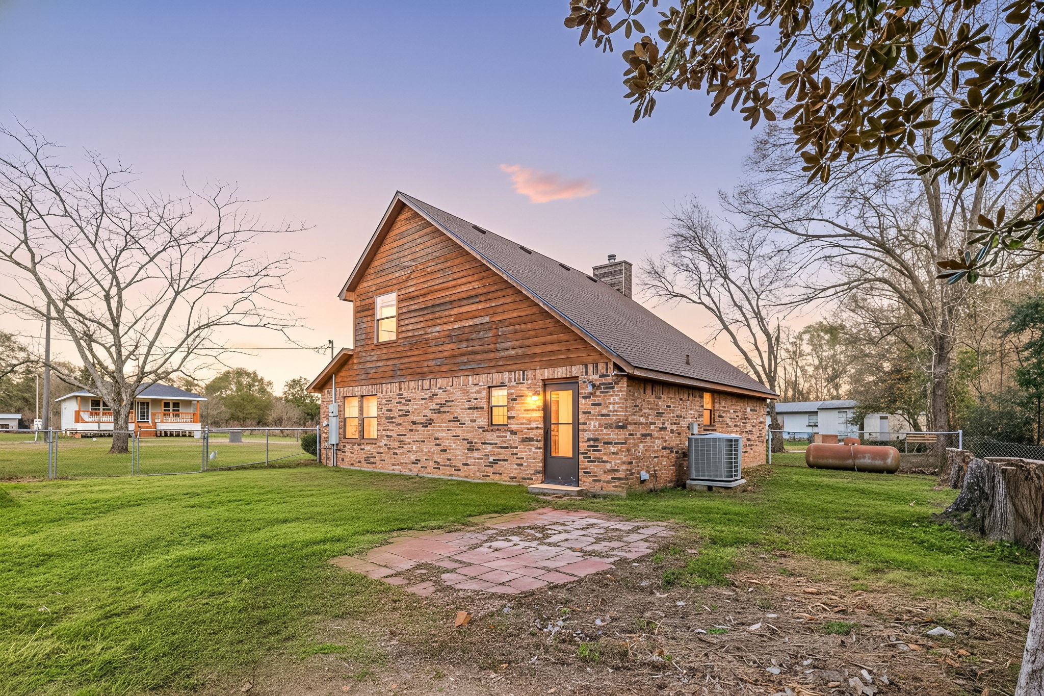 236 Pine Ridge Drive Cleveland, TX 77327 - Photo 2 of 30 a front view of a house with a garden and trees