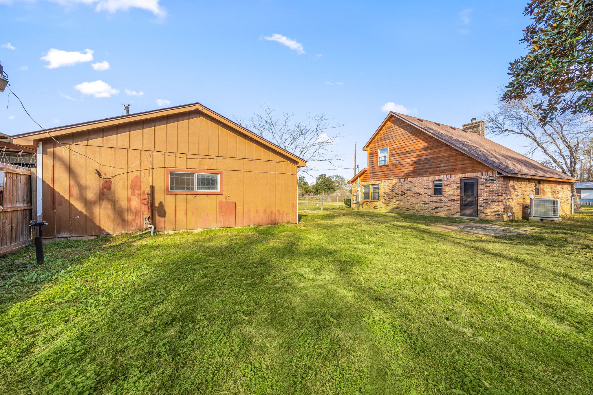 236 Pine Ridge Drive Cleveland, TX 77327 - Photo 22 of 30 a view of a house with a backyard