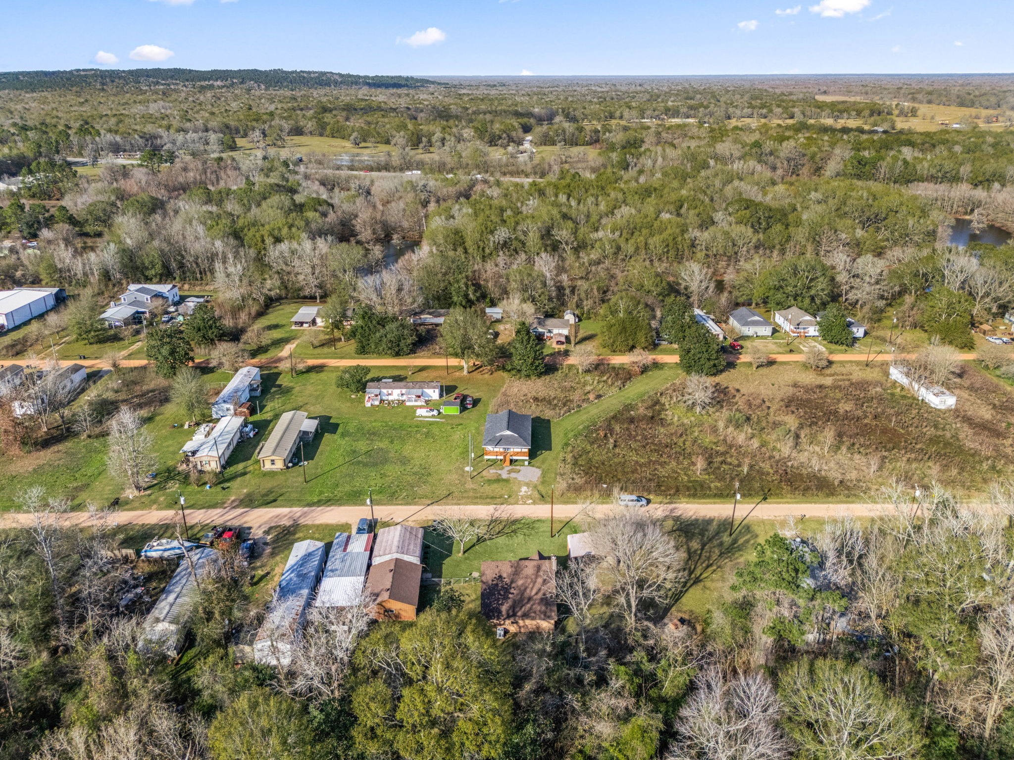 236 Pine Ridge Drive Cleveland, TX 77327 - Photo 28 of 30 an aerial view of residential houses with outdoor space