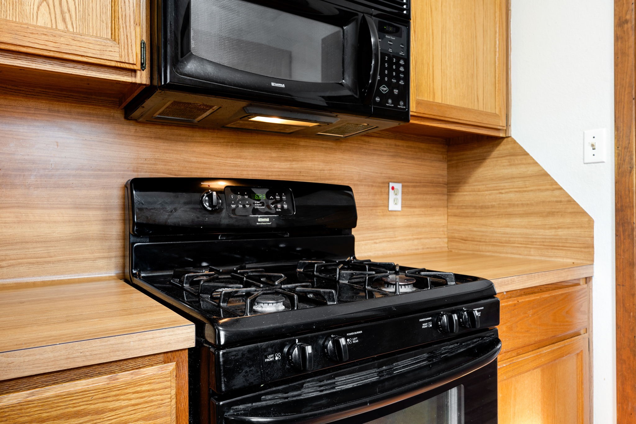 236 Pine Ridge Drive Cleveland, TX 77327 - Photo 9 of 30 a stove top oven sitting inside of a kitchen
