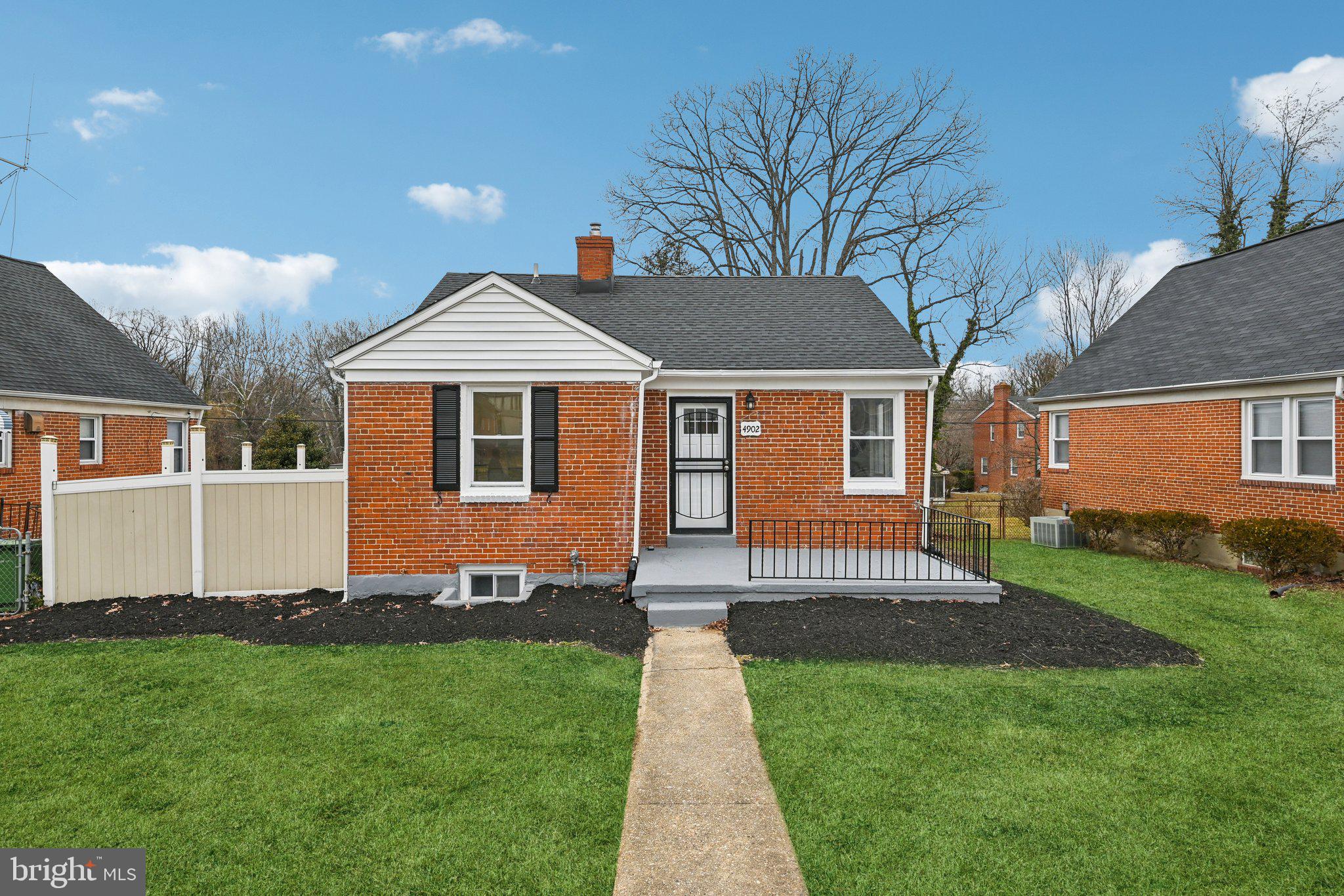 4902 Gilray Drive Baltimore, MD 21214 - Photo 1 of 54 a front view of a house with a garden