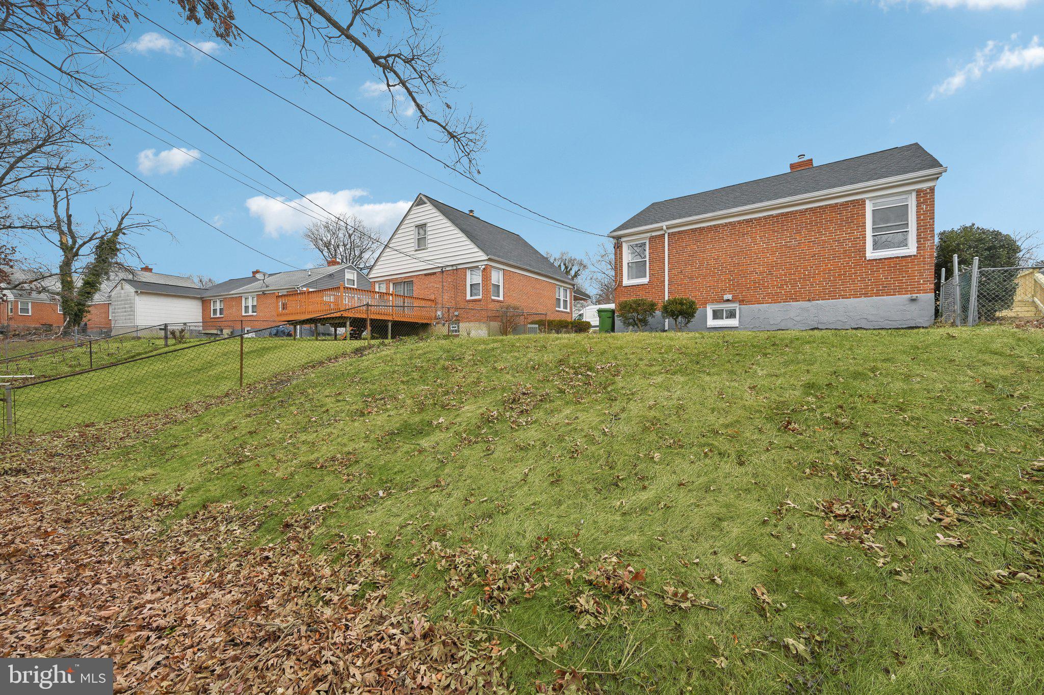 4902 Gilray Drive Baltimore, MD 21214 - Photo 45 of 54 a backyard of a house with table and chairs